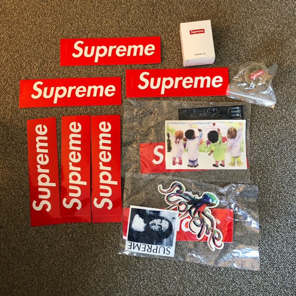 Supreme stickers, shower cap, and bouncy ball